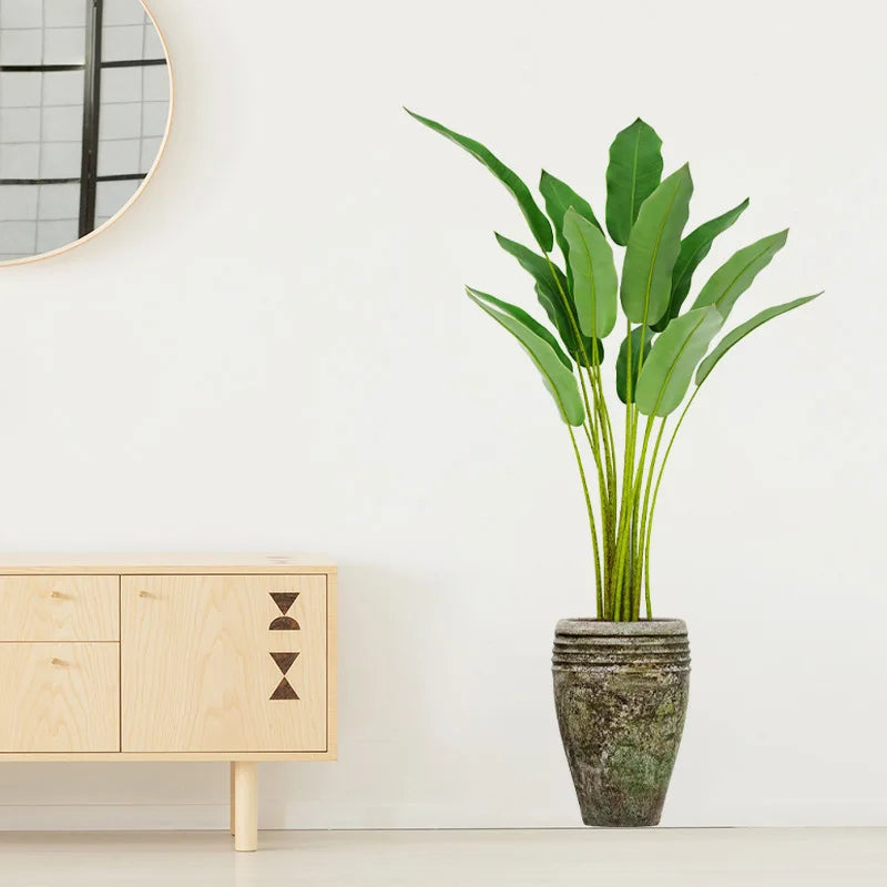 Autocollant vinyle plante verte en pot posé sur mur de salon, ambiance végétale et déco intérieure fraîche - Décoration intérieure