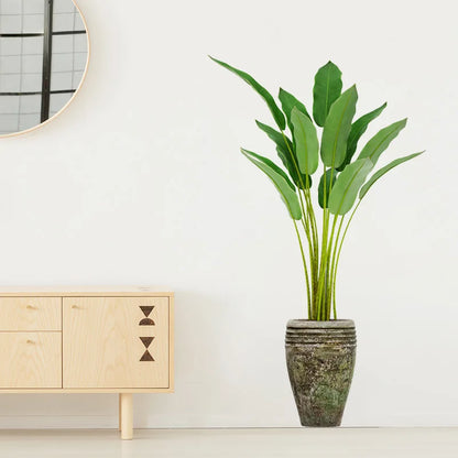 Autocollant vinyle plante verte en pot posé sur mur de salon, ambiance végétale et déco intérieure fraîche - Décoration intérieure