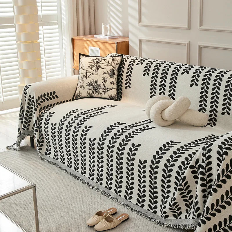 Housse de canapé style nordique en chenille avec motifs géométriques Boho et glands décoratifs, idéale pour salon cosy ou lit décontracté. Décoration intérieure