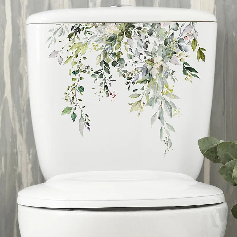 Sticker mural à motif feuilles vertes posé en décoration dans une salle de bain ou toilettes, ambiance naturelle et fraîche avec vinyle imperméable - Décoration intérieure