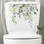 Sticker mural à motif feuilles vertes posé en décoration dans une salle de bain ou toilettes, ambiance naturelle et fraîche avec vinyle imperméable - Décoration intérieure
